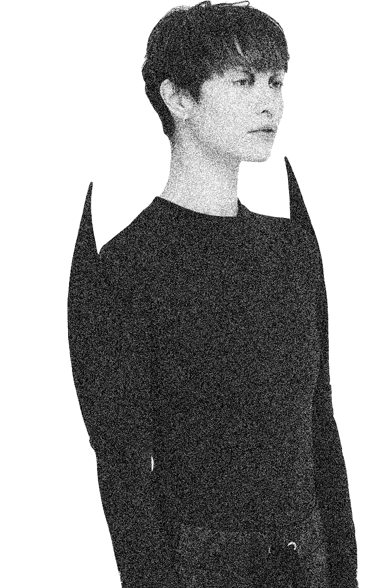 model wearing black fitted top with pointed shoulders punk dark fashion 