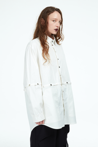 white shirt with silver snaps