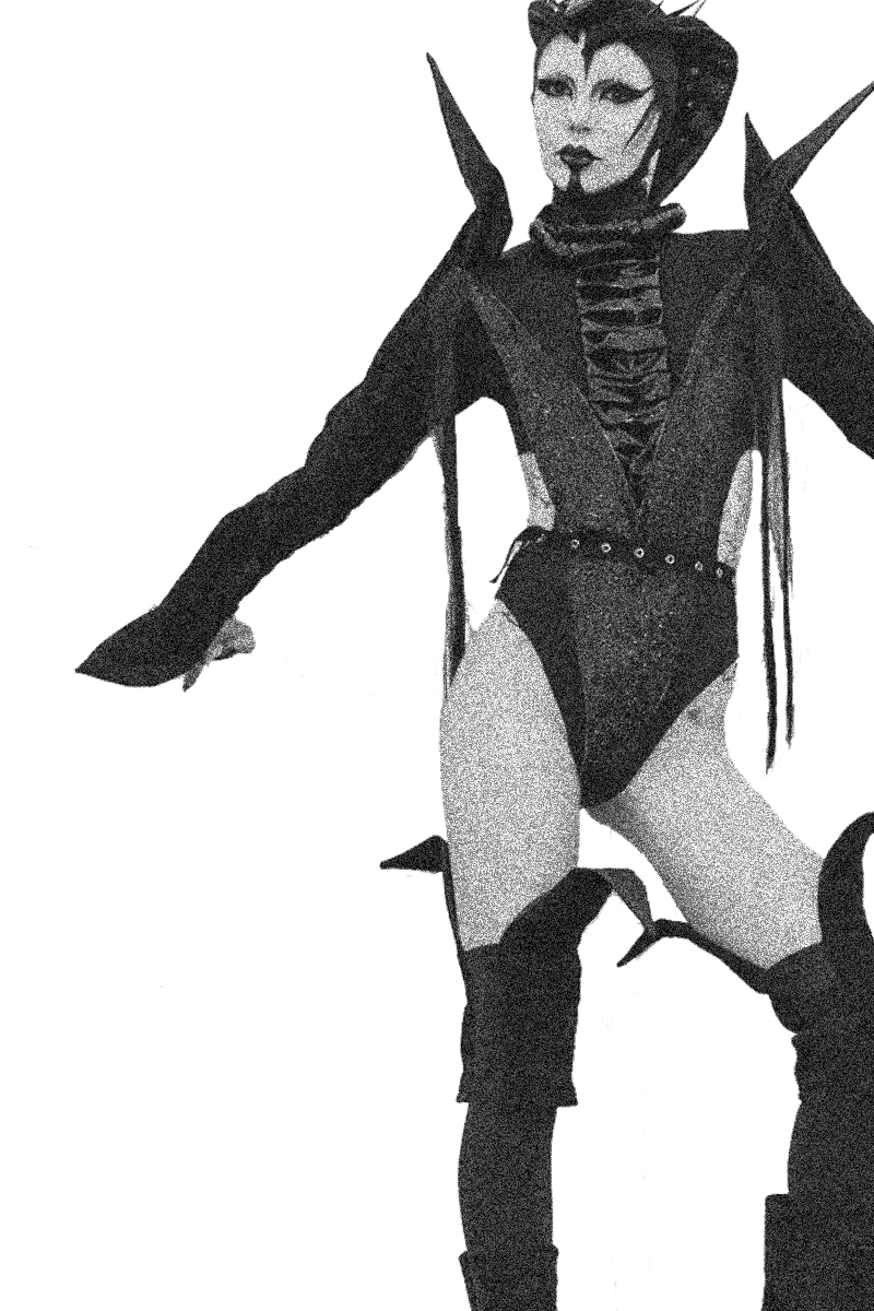 artist bambiethug wearing a black alien costume with spikes punk dark fashion stage outfit