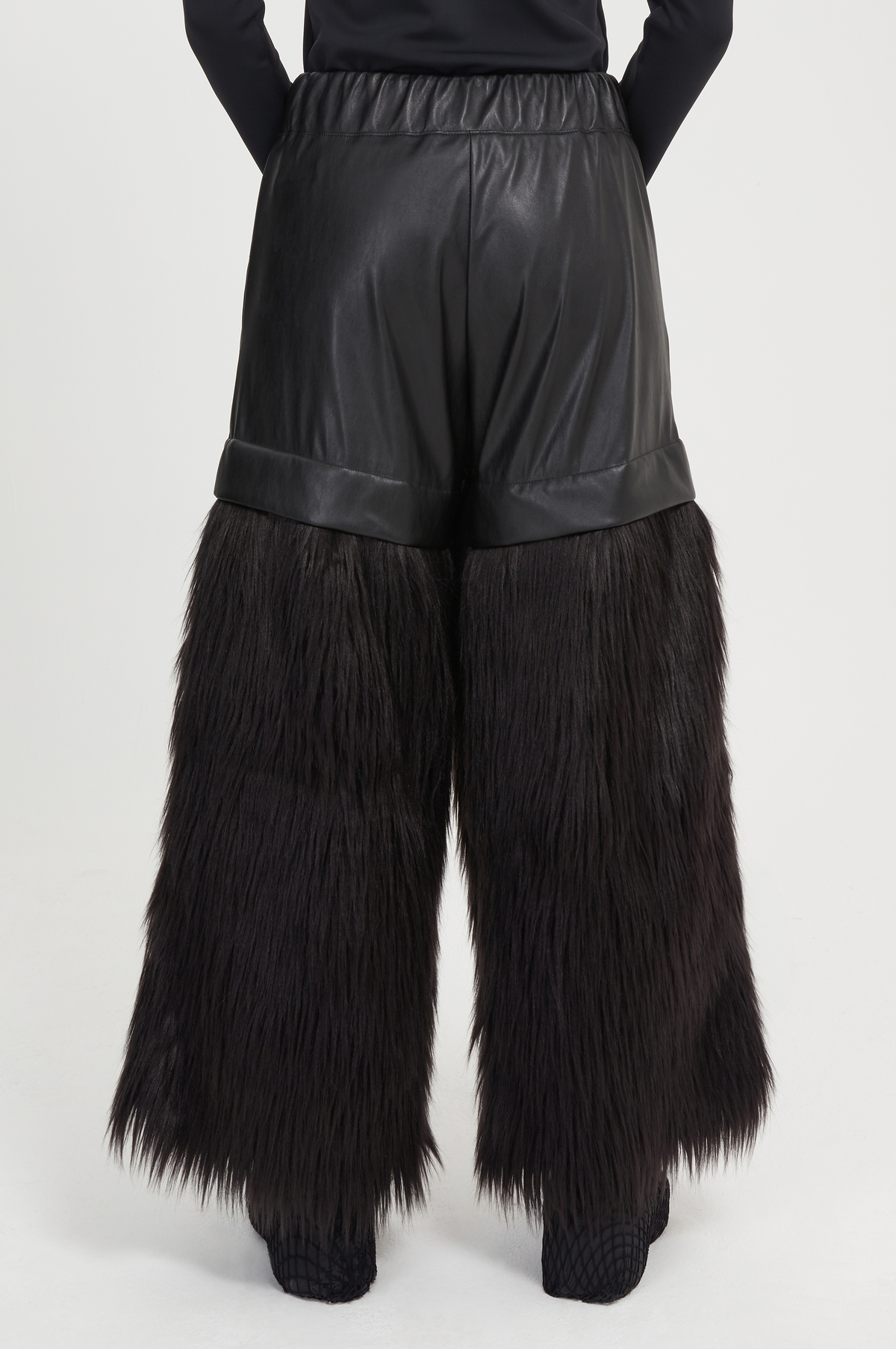 black vegan leather and faux fur trousers
