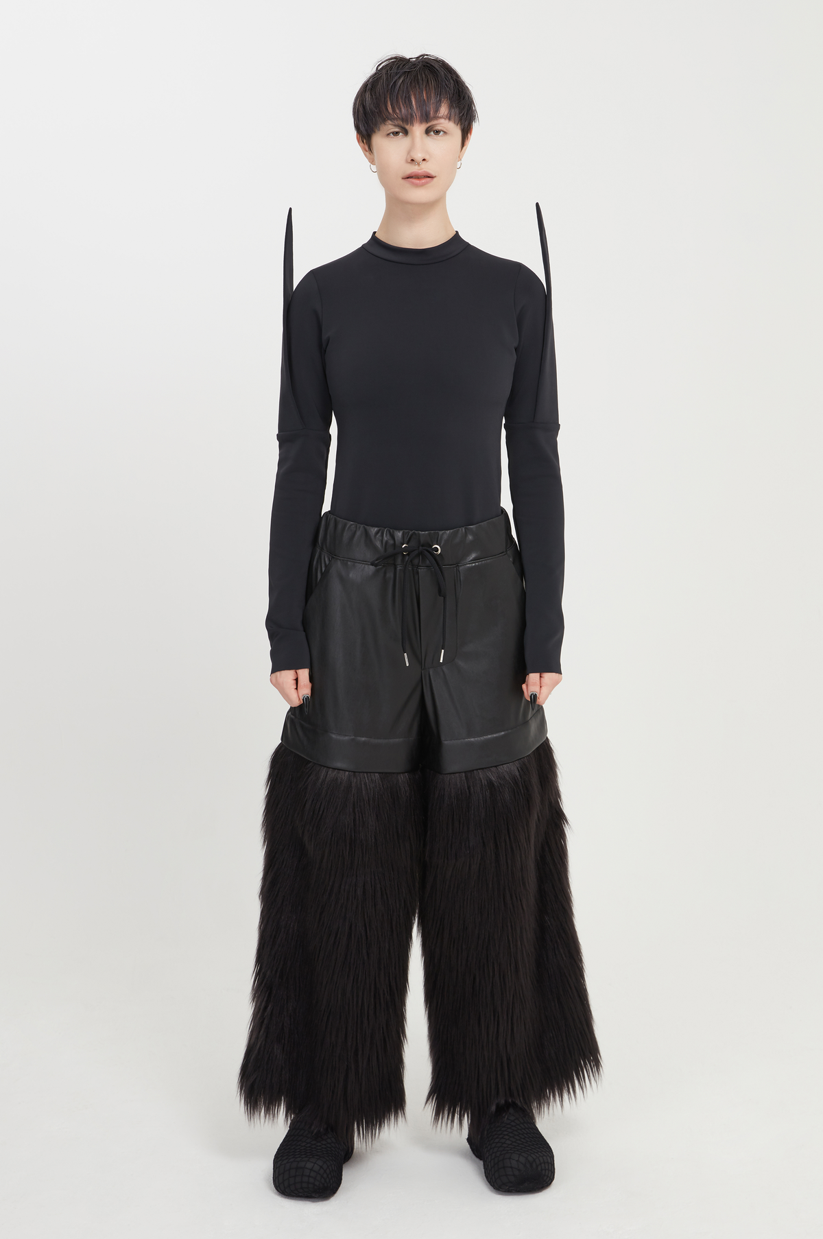 black vegan leather and faux fur trousers