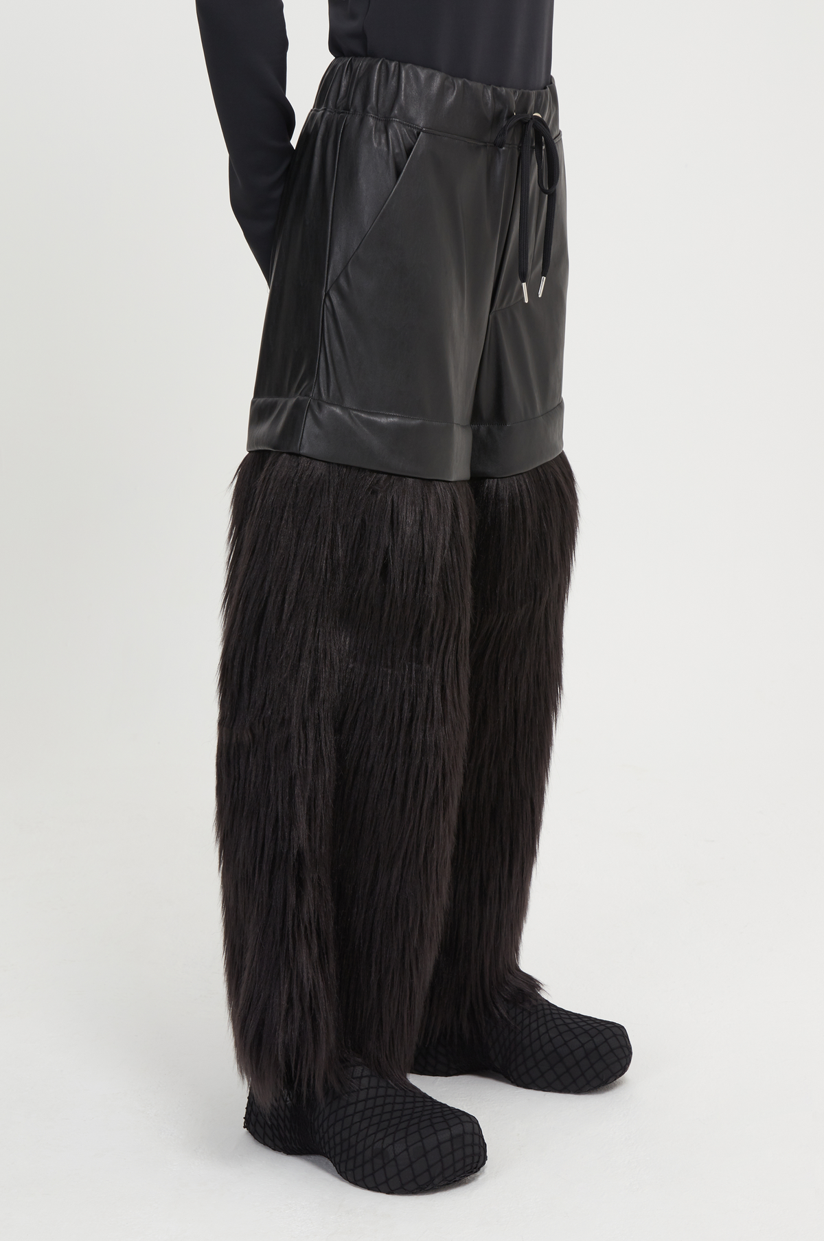 black vegan leather and faux fur trousers