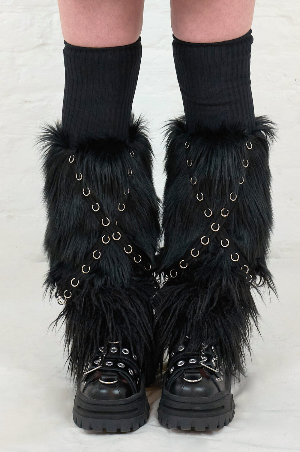 Long black faux fur leg warmers with punk grommets 