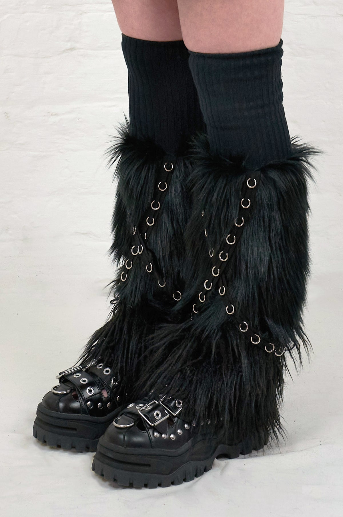 Long black faux fur leg warmers with punk grommets 